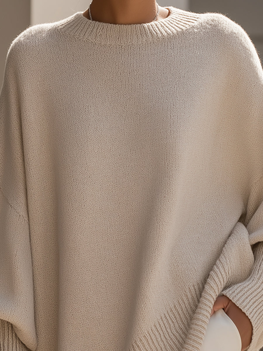 A woman wearing a soft crew neck sweater with jeans for a warm, easy everyday look.