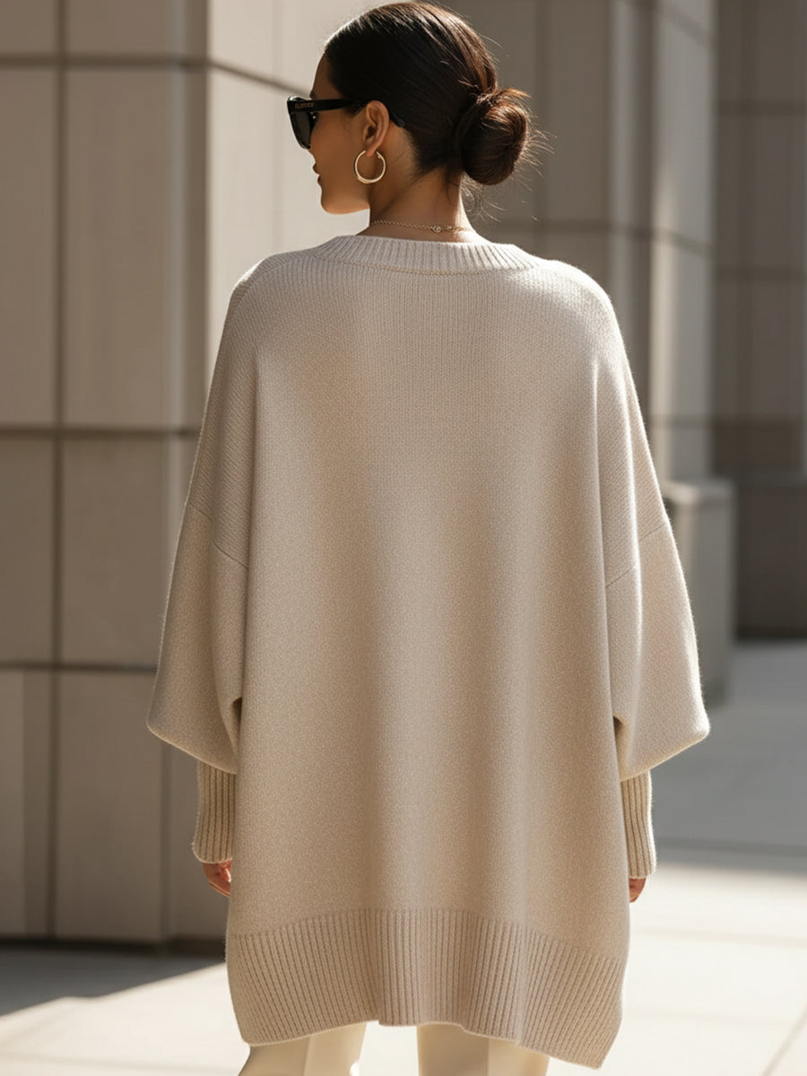 A woman wearing a soft crew neck sweater with jeans for a warm, easy everyday look.