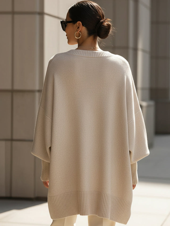 A woman wearing a soft crew neck sweater with jeans for a warm, easy everyday look.