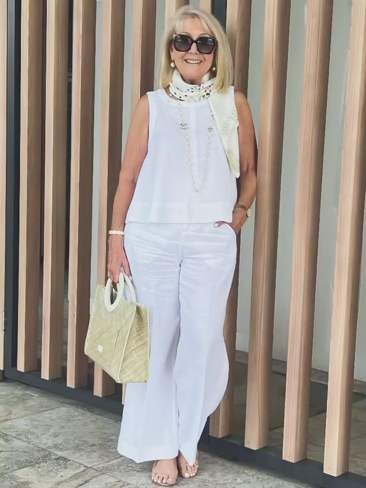 A woman wearing a chic minimal two-piece set with a soft, flattering silhouette.