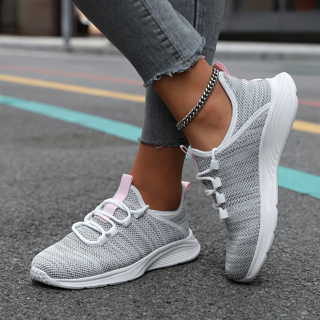 A woman walking comfortably in lightweight breathable sneakers with pants