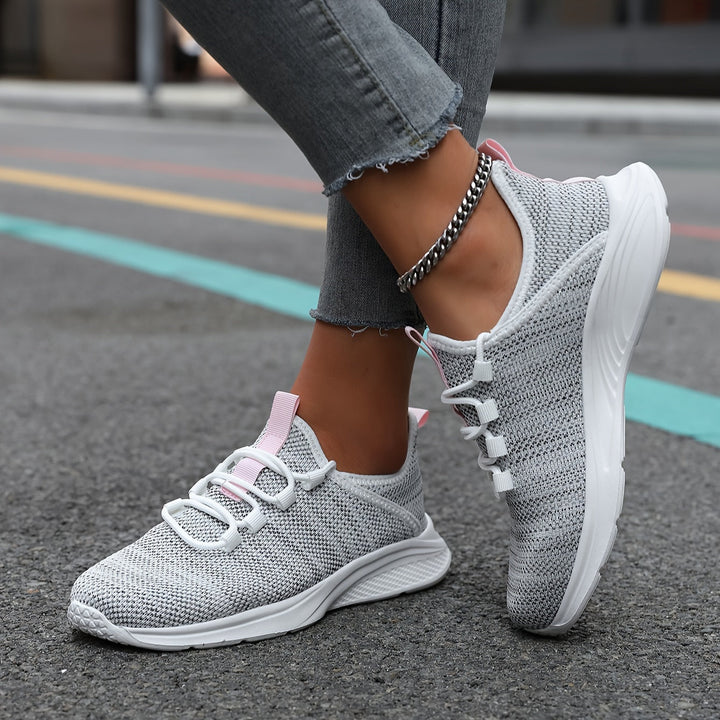 A woman walking comfortably in lightweight breathable sneakers with pants