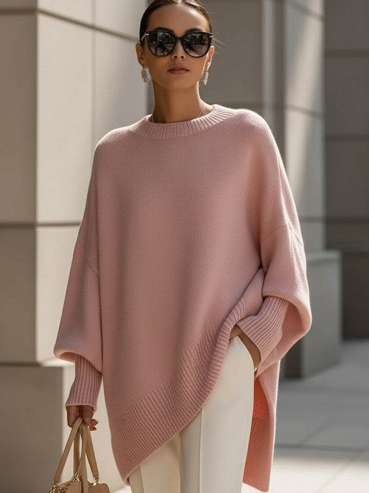 A woman wearing a soft crew neck sweater with jeans for a warm, easy everyday look.