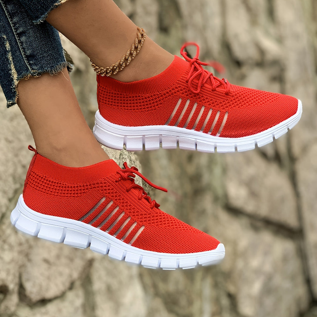A woman wearing light breathable sock-style comfort shoes