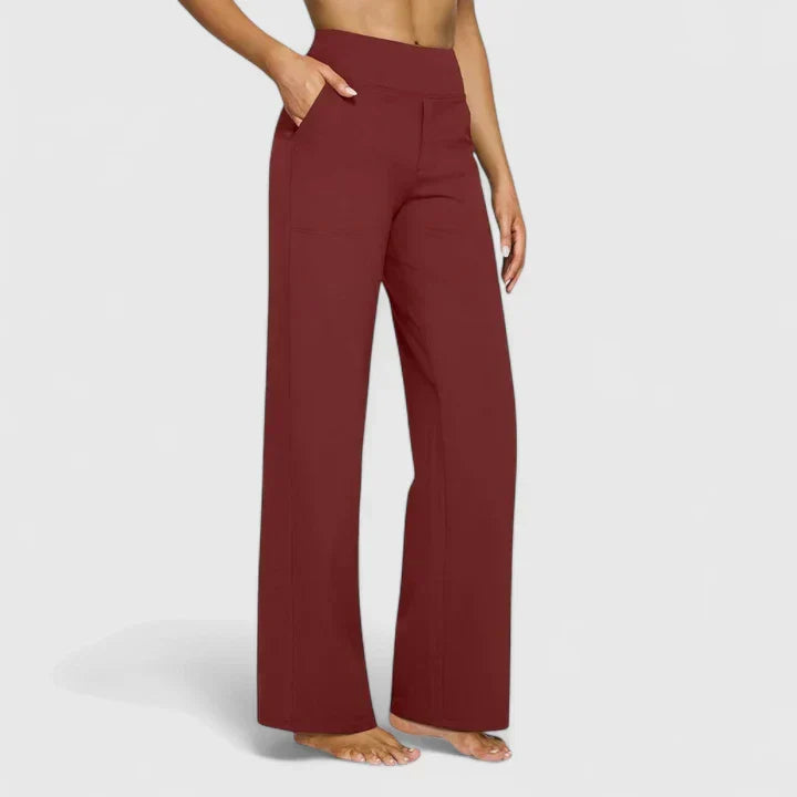 A woman in tailored pants styled with a simple top for an elegant, comfortable everyday look.