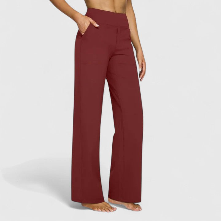 Woman wearing pull-on pants with a soft blouse, relaxed and comfortable at home.