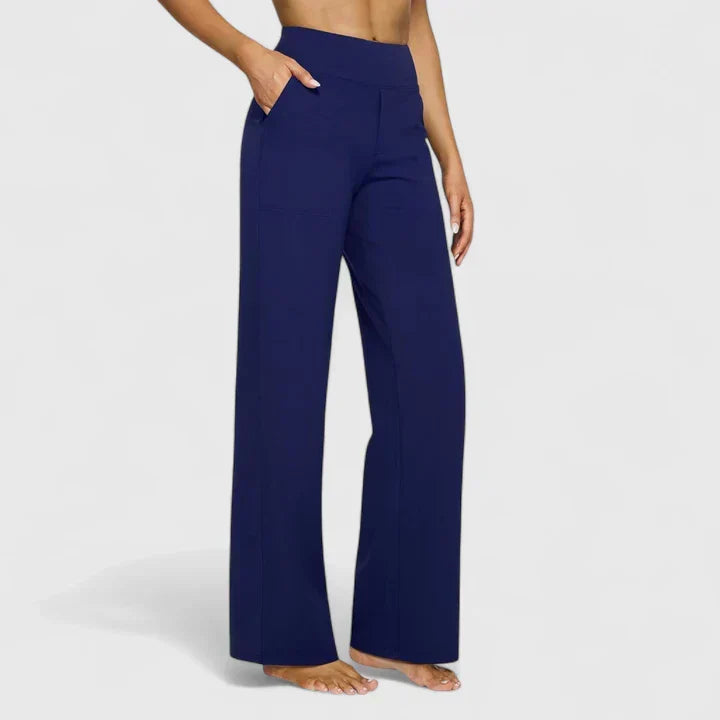 A woman in tailored pants styled with a simple top for an elegant, comfortable everyday look.