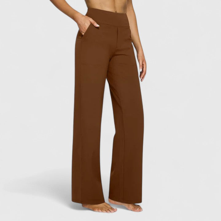 Woman wearing pull-on pants with a soft blouse, relaxed and comfortable at home.