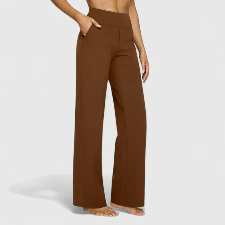 A woman in tailored pants styled with a simple top for an elegant, comfortable everyday look.
