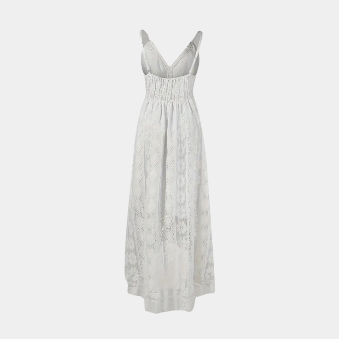 Woman wearing the Jill™ elegant boho midi dress with intricate detailing and a V-neckline at a summer garden party.