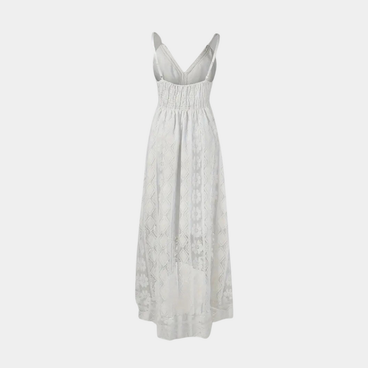 Woman wearing the Jill™ elegant boho midi dress with intricate detailing and a V-neckline at a summer garden party.