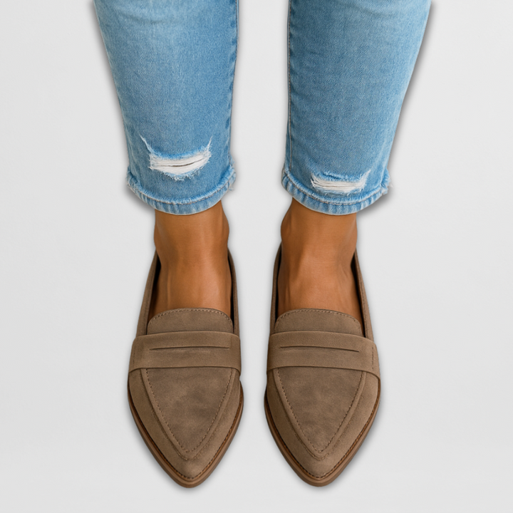 A woman wearing soft-touch loafers on a relaxed day out.
