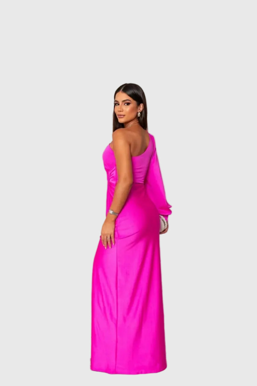 Woman wearing a long flowing evening maxi dress with elegant, graceful lines.