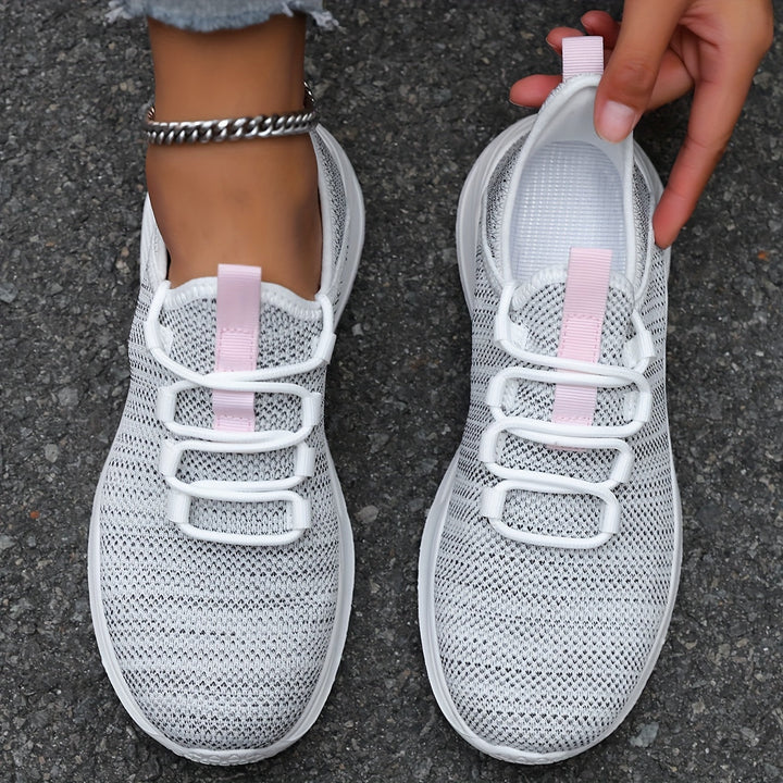 A woman walking comfortably in lightweight breathable sneakers with pants