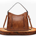 A woman carrying an elegant luxury shoulder bag with a rich finish