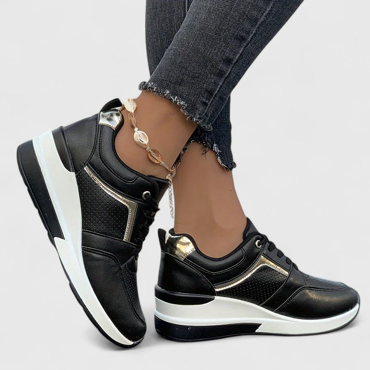 A woman standing comfortably in cushioned orthopaedic shoes