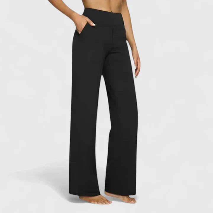 A woman in tailored pants styled with a simple top for an elegant, comfortable everyday look.