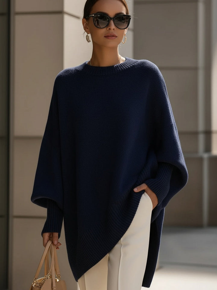 A woman wearing a soft crew neck sweater with jeans for a warm, easy everyday look.