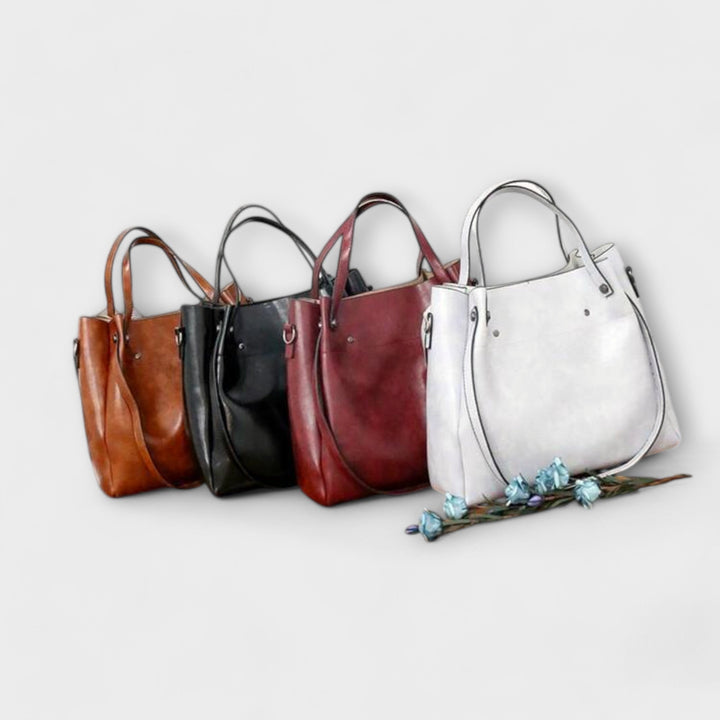 A woman carrying a coordinated vintage-style four-piece bag set on a day out