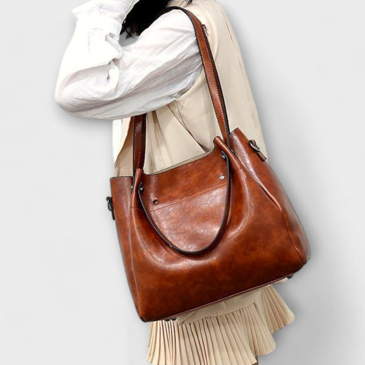 A woman carrying a coordinated vintage-style four-piece bag set on a day out
