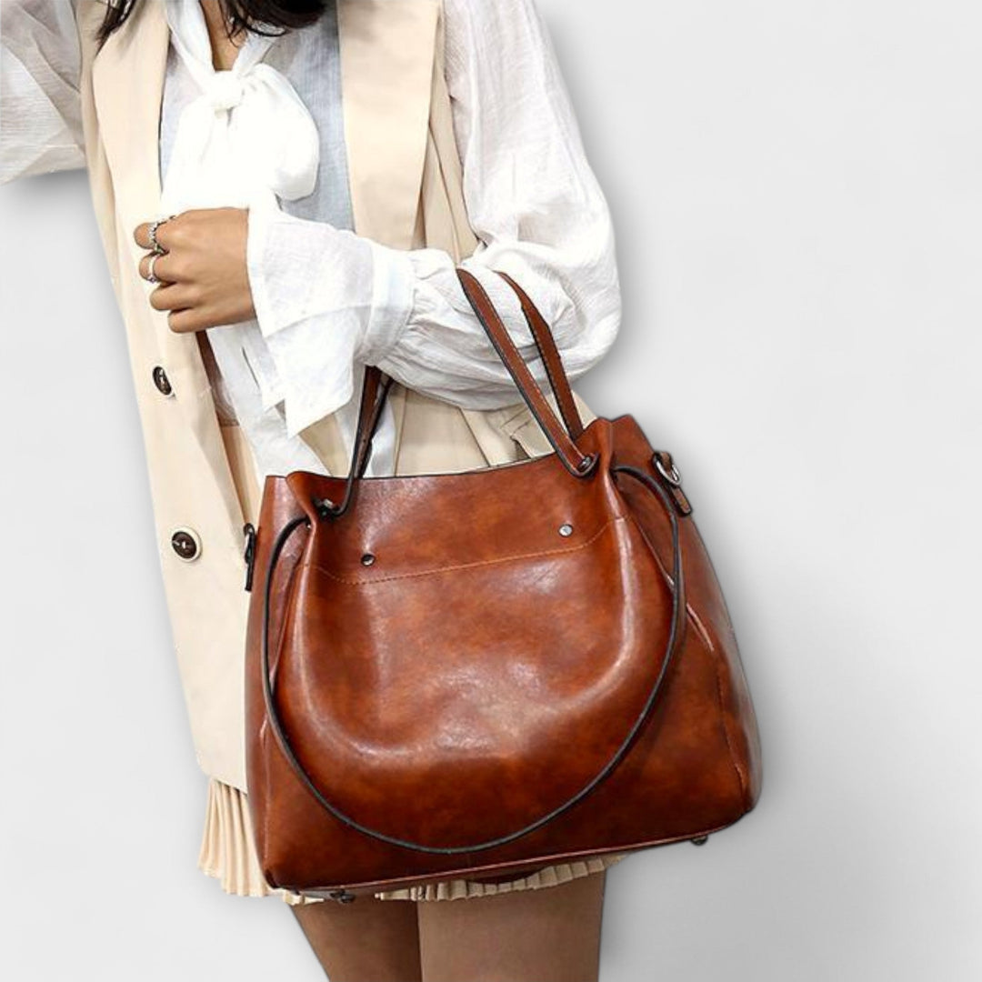 A woman carrying a coordinated vintage-style four-piece bag set on a day out