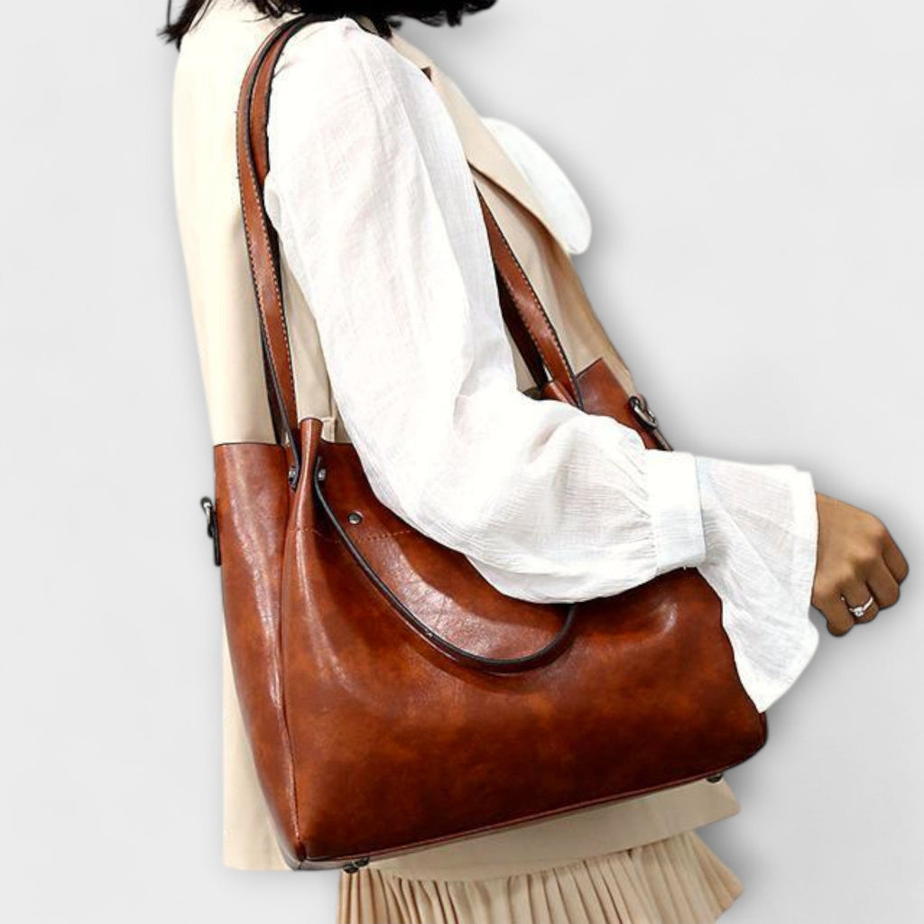 A woman carrying a coordinated vintage-style four-piece bag set on a day out