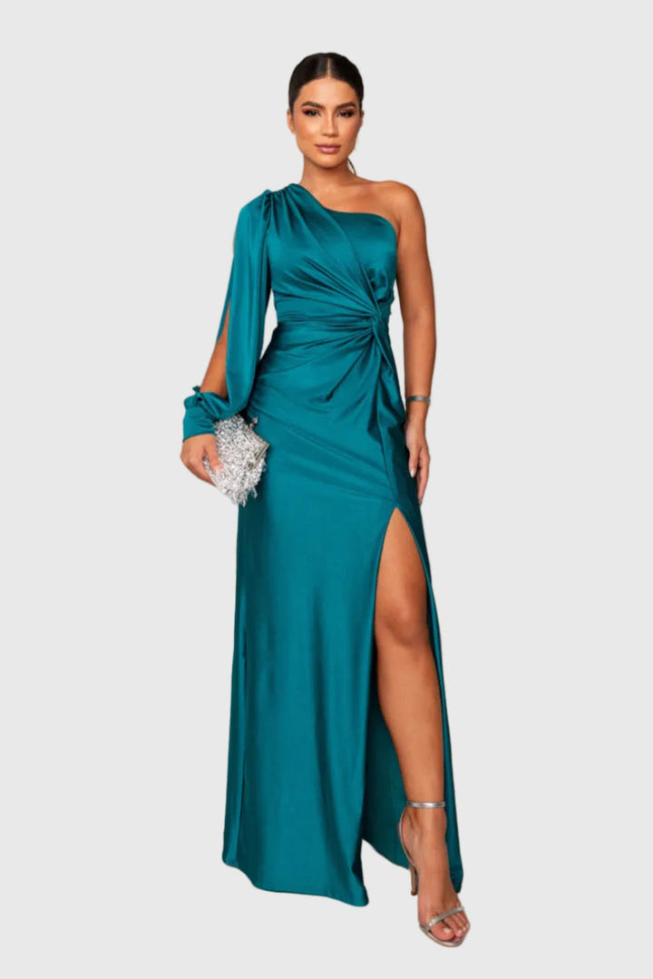 Woman wearing a long flowing evening maxi dress with elegant, graceful lines.