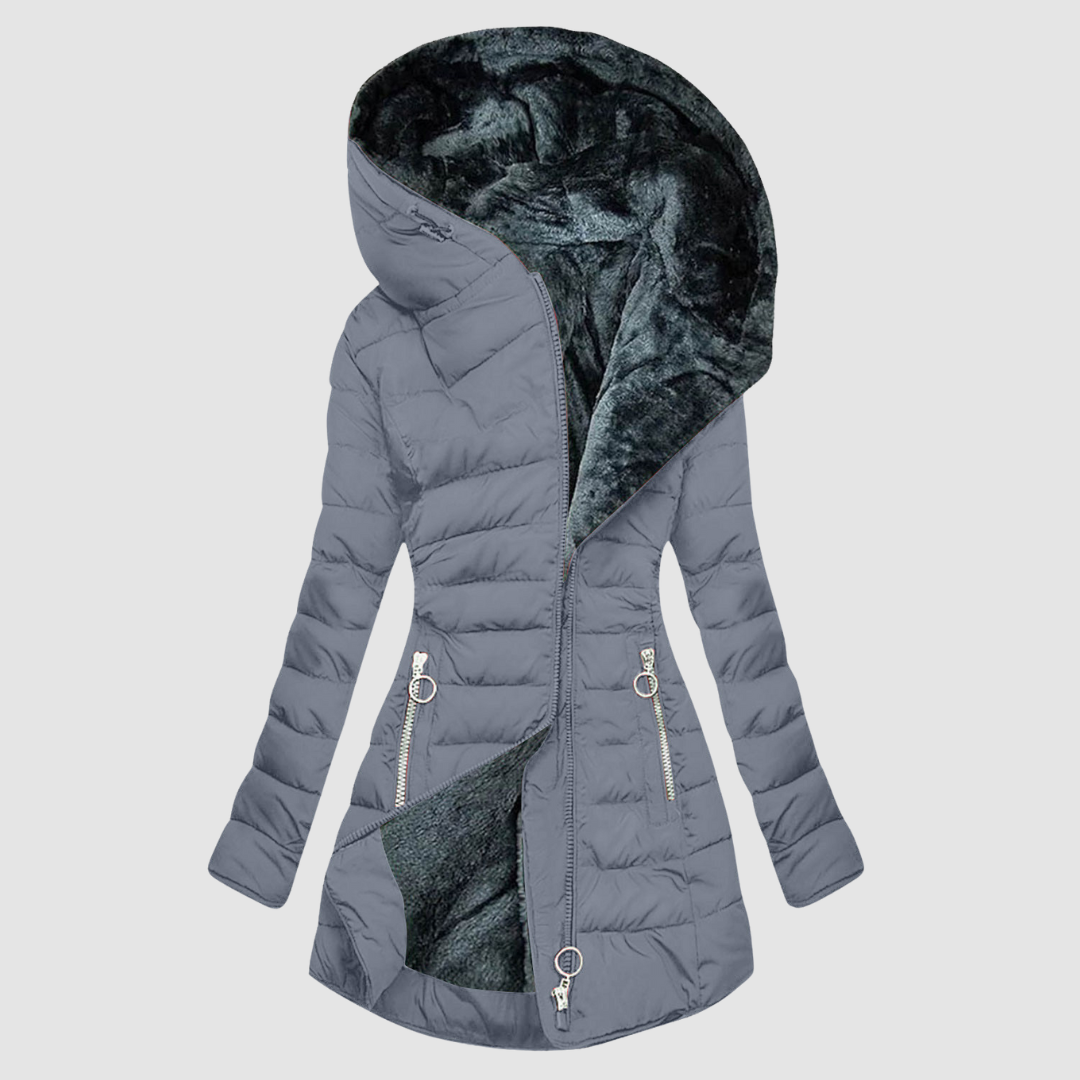 A sage green quilted winter coat with a deep, soft-lined hood and an angled zip front.