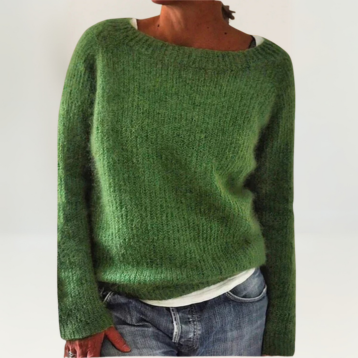 A woman wearing a soft, relaxed everyday sweater, comfortable and elegant with jeans.