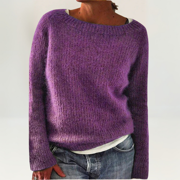 A woman wearing a soft, relaxed everyday sweater, comfortable and elegant with jeans.