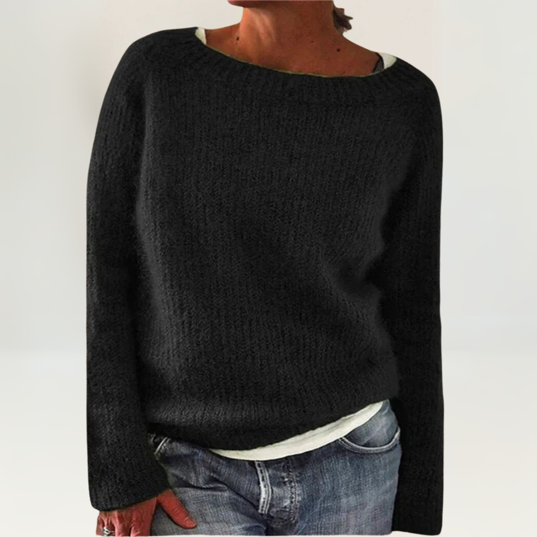 A woman wearing a soft, relaxed everyday sweater, comfortable and elegant with jeans.