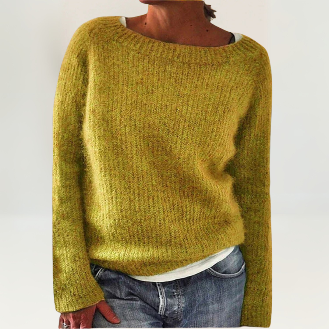 A woman wearing a soft, relaxed everyday sweater, comfortable and elegant with jeans.