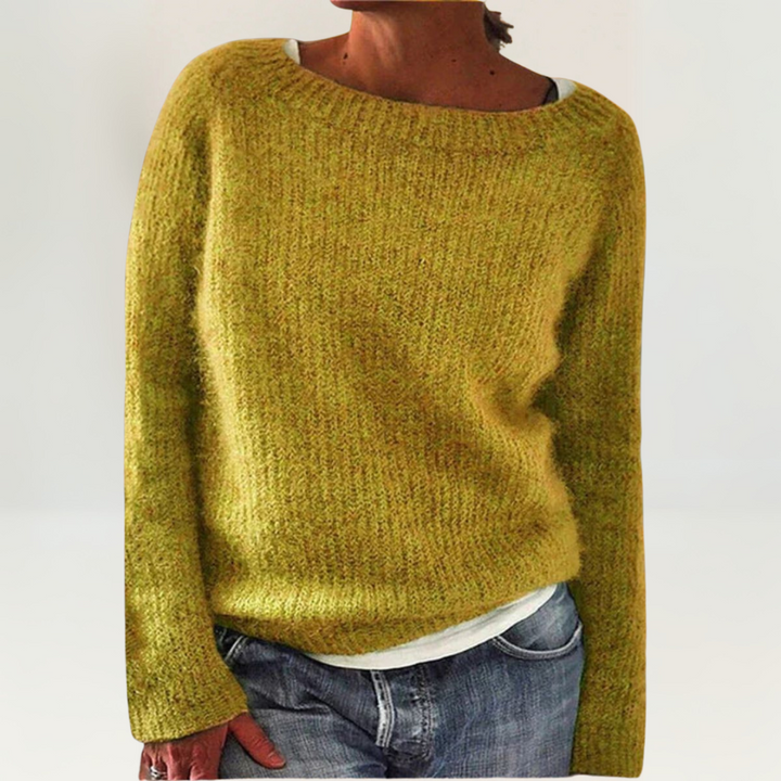 A woman wearing a soft, relaxed everyday sweater, comfortable and elegant with jeans.