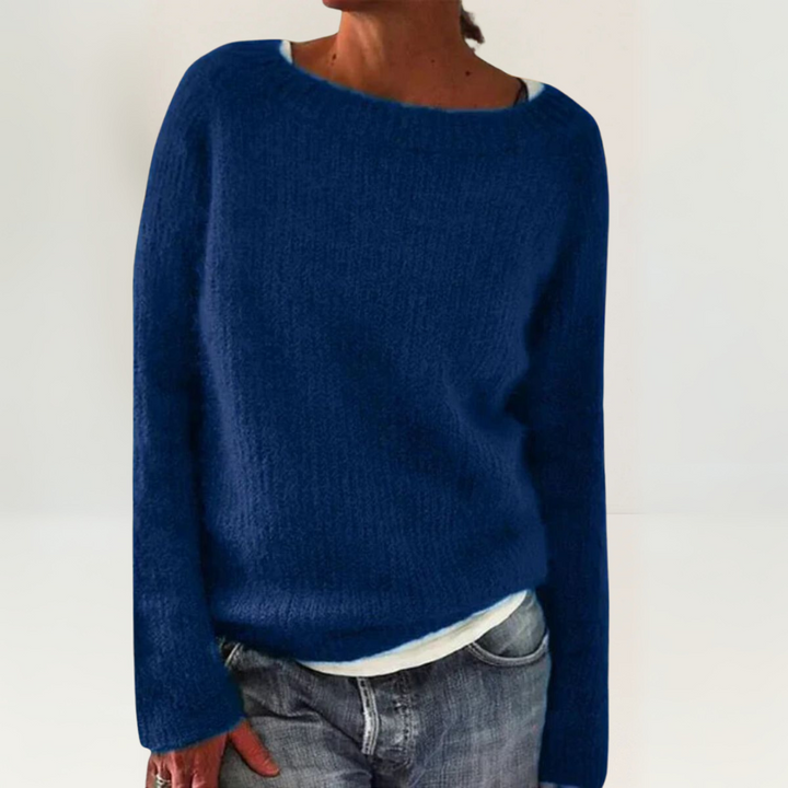 A woman wearing a soft, relaxed everyday sweater, comfortable and elegant with jeans.
