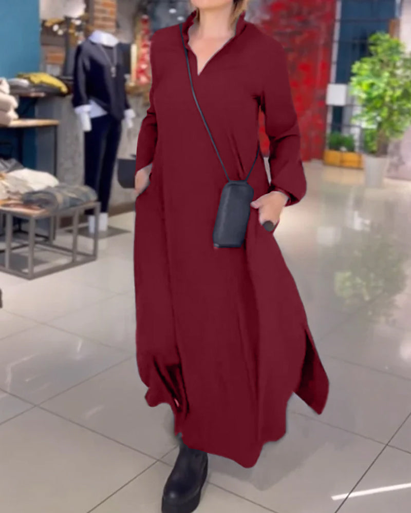 Woman wearing the Patricia relaxed maxi dress with revere collar, standing by a doorway.