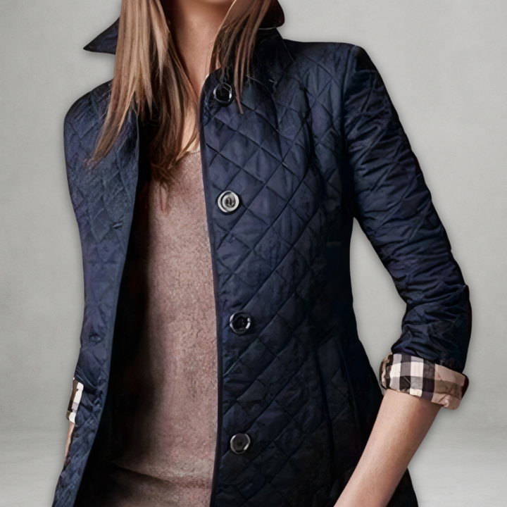 A woman wearing an fall jacket over a top, layered for a crisp day in town.