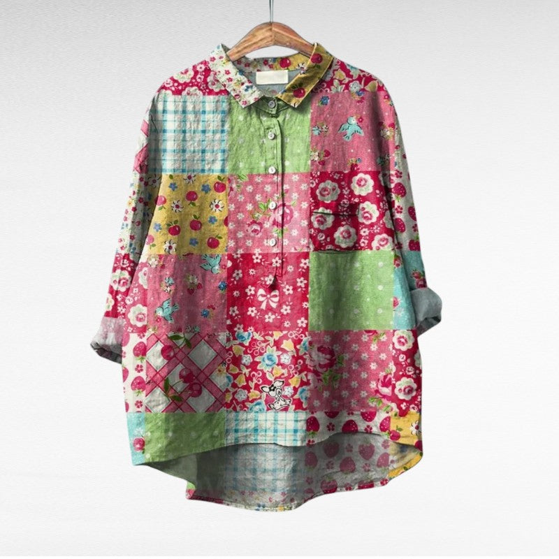 A woman wearing an elegant printed summer blouse with pants, looking cool and stylish on a warm day.