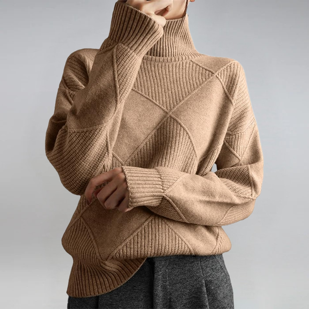 A woman in a stand-collar sweater with an elegant drape, styled with tailored pants.