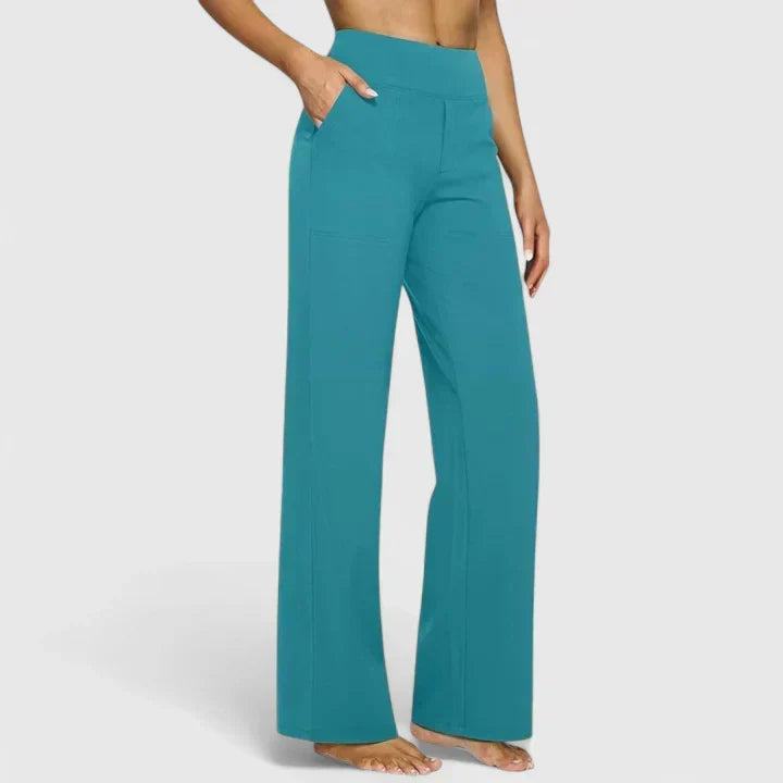 A woman in tailored pants styled with a simple top for an elegant, comfortable everyday look.