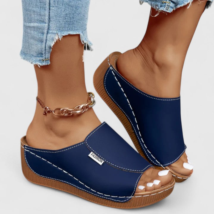 A woman in tan lightweight sandals stepping out gracefully, feet cushioned and supported.