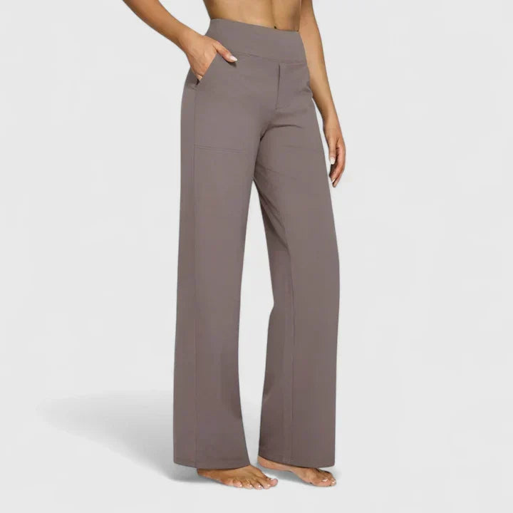 A woman in tailored pants styled with a simple top for an elegant, comfortable everyday look.
