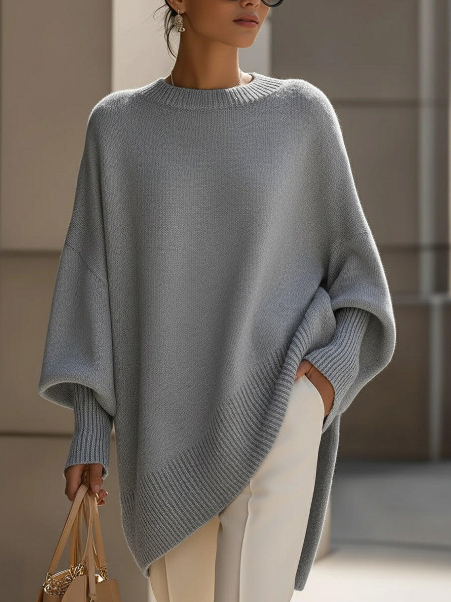 A woman wearing a soft crew neck sweater with jeans for a warm, easy everyday look.