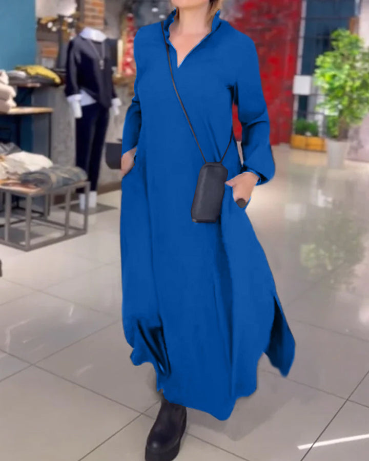 Woman wearing the Patricia relaxed maxi dress with revere collar, standing by a doorway.