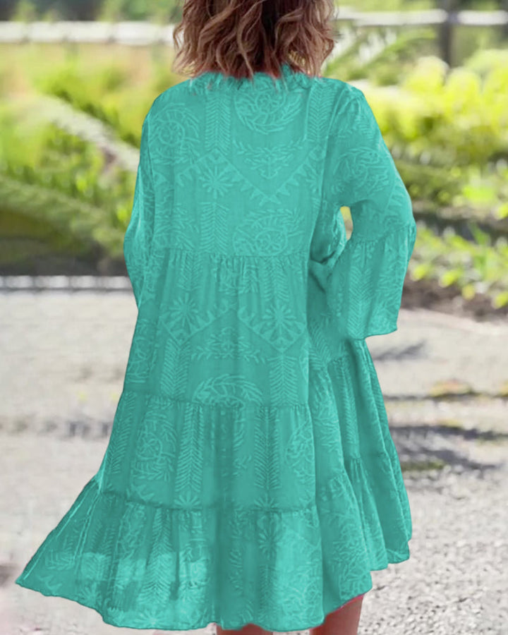 Woman in a loose boho print midi dress enjoying a relaxed day outdoors.