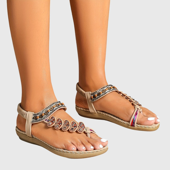 A woman standing comfortably in wide-fit cushioned support sandals with open-toe straps.