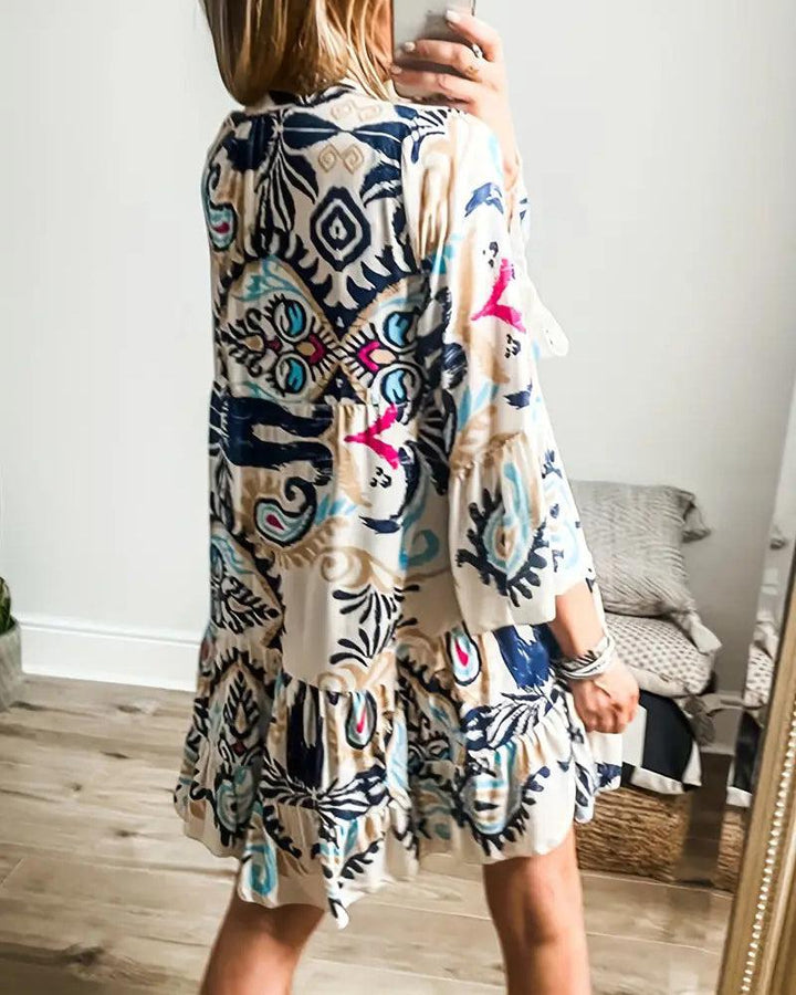 A woman wearing a relaxed boho print tunic dress on a warm, sunny day.