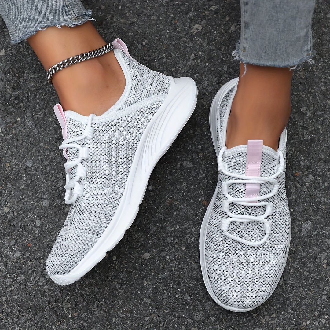 A woman walking comfortably in lightweight breathable sneakers with pants