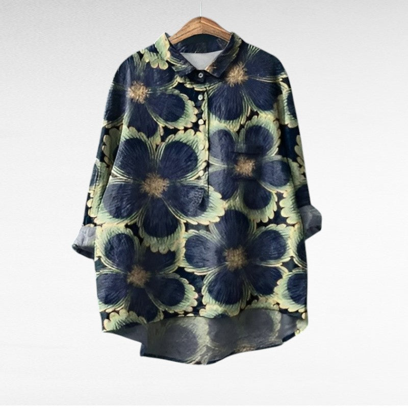 Woman wearing a printed summer blouse with a gentle, flattering drape.