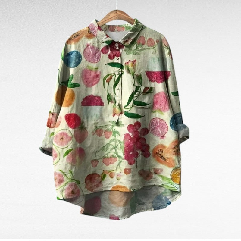 Woman wearing a printed summer blouse with a gentle, flattering drape.