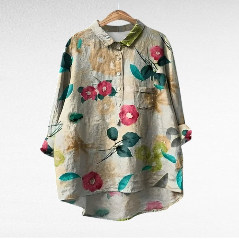 Woman wearing a printed summer blouse with a gentle, flattering drape.